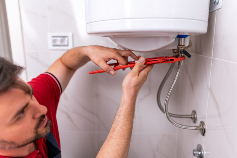 plumber repairing hot water system in modern bathr 2026 03 25 10 05 07 utc