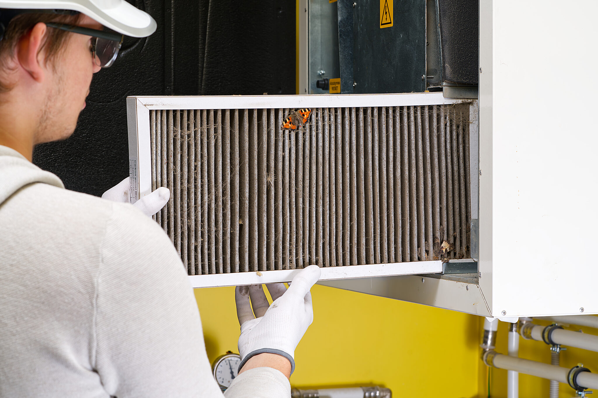 replacing filter in the central ventilation system. hvac filter replacing home central air system